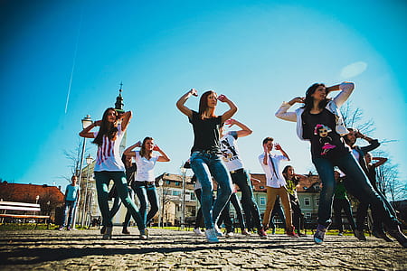 group of people dancing on open field during daytime thumbnail