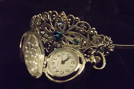 round silver-colored analog pocket watch thumbnail