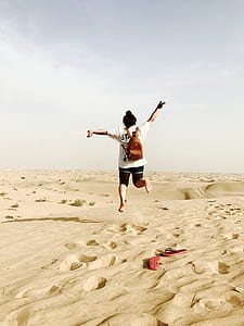 woman in white shirt on desert thumbnail