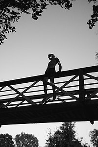 man on the bridge during daytime thumbnail