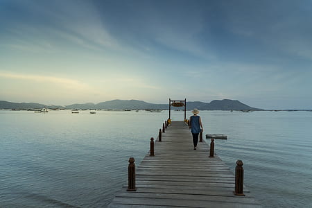 woman walking on dock thumbnail