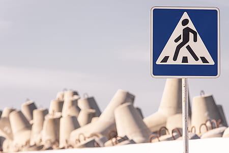 pedestrian lane signage near rock thumbnail