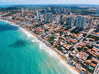 city near beach during daytime aerial photography thumbnail