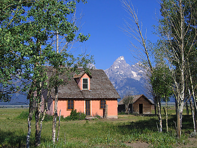 house near mountain alps under calming sky thumbnail