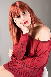 woman wearing red long-sleeved dress and red lipstick thumbnail
