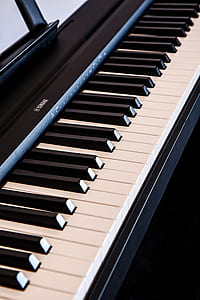 close-up photography of white and black Yamaha electronic keyboard thumbnail