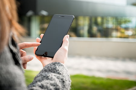 person holding black smartphone thumbnail