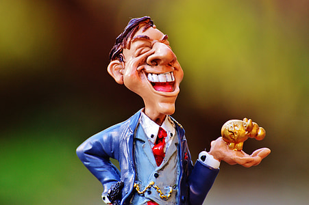 man holding gold pig figurine thumbnail
