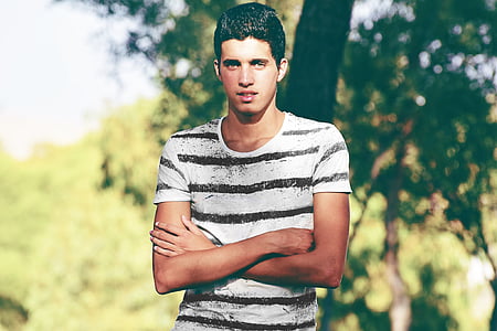 man in white and black striped crew-neck shirt thumbnail
