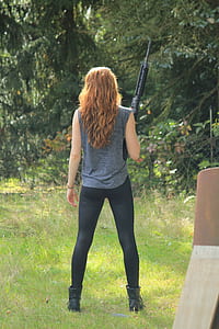 woman holding rifle thumbnail