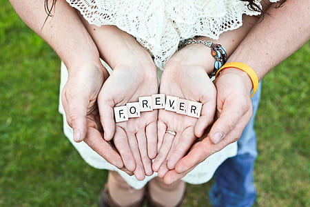Forever scrabble letters on person hand thumbnail