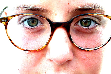 person wearing eyeglasses with brown frames thumbnail