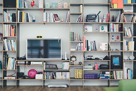 flat screen TV on multilayered shelf thumbnail