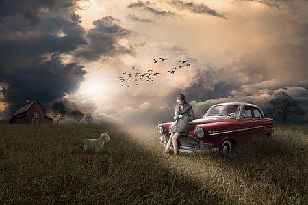 woman leaning of the hood red vintage sedan on green field thumbnail