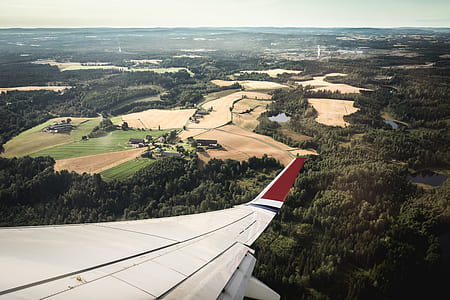 airliner wing over landscape view thumbnail