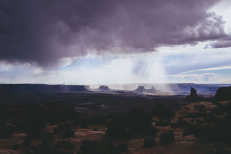 gray clouds with rays of sun on Monument Valley thumbnail