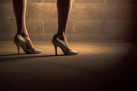 woman in beige pumps standing near wall thumbnail