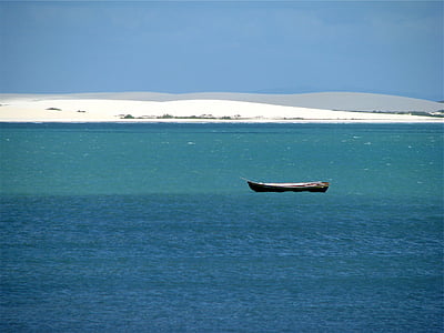 boat on body of water near seashore thumbnail