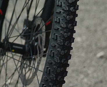 shallow focus photography of black bicycle wheel thumbnail