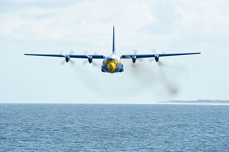 white and gray airplane over body of water thumbnail