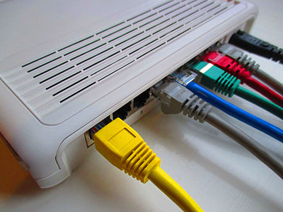 assorted-colored wires connected through gray router thumbnail