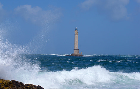 grey concrete lighthouse in the middle of blue ocean during daylight thumbnail