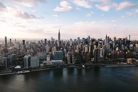 buildings near body of water during daytime thumbnail