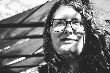 grayscale photo of woman wearing eyeglasses thumbnail