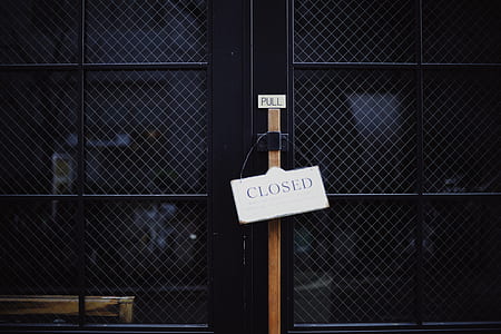 black door with closed sign thumbnail