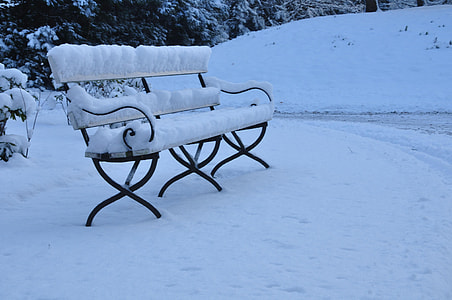 black steel bench with snow on top thumbnail