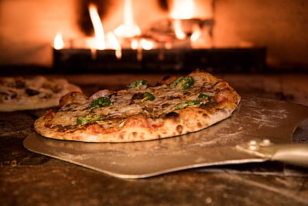 Baked Pizza on Pizza Peel in Oven thumbnail