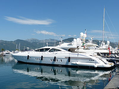 white boat docked at daytime thumbnail