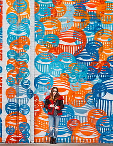 woman standing and leaning on wall thumbnail