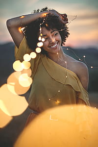 woman holding string bulbs outdoor thumbnail