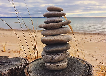 closeup photo of stones near sea at daytime thumbnail