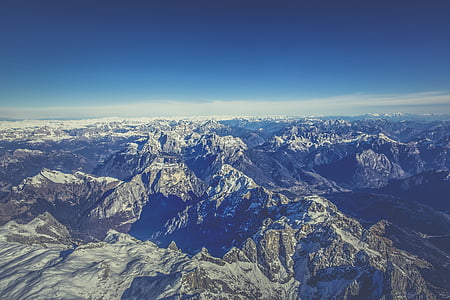 brown mountains under blue clouds thumbnail