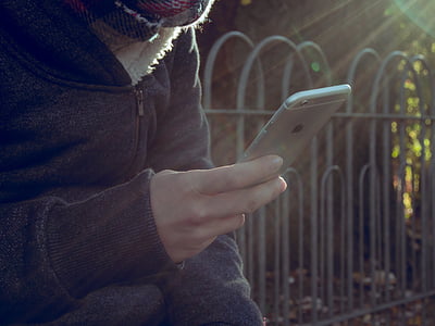 person holding silver iPhone thumbnail