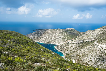 aerial photography of lake between mountains thumbnail