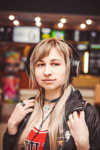 woman in black jacket with headphones thumbnail