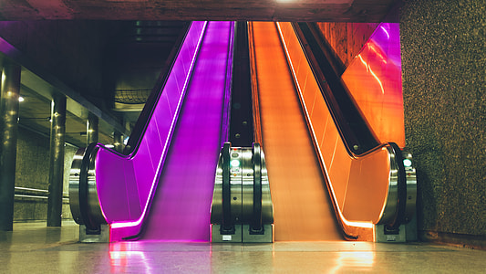 orange and purple escalator inside building thumbnail