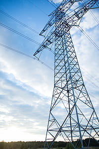 Gray Transmission Line Under Blue Sky at Daytime thumbnail
