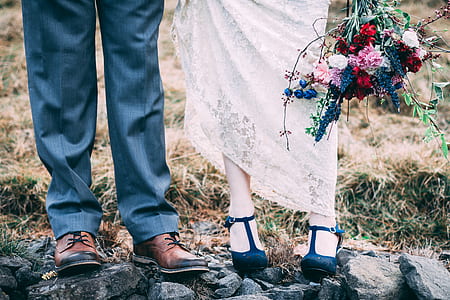 man and woman standing on rock thumbnail
