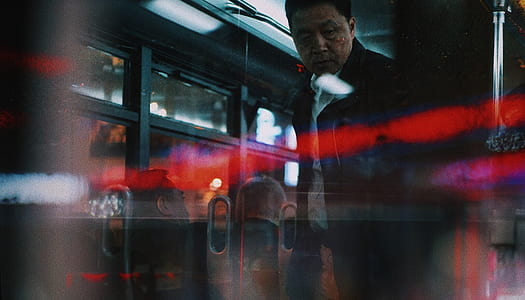 man opening clear glass door thumbnail