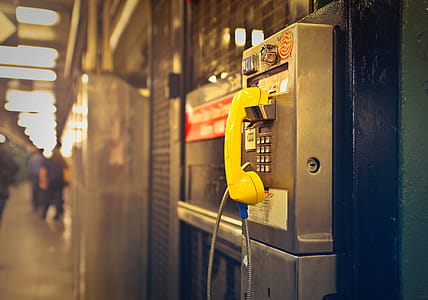 View of Yellow public pay phone thumbnail