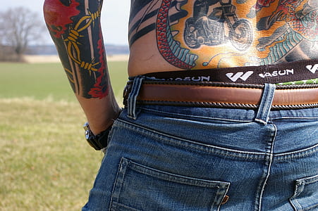 person wearing blue denim bottoms thumbnail