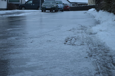 vehicles passing on wet road at daytime thumbnail