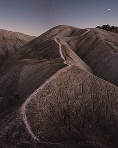 rock formation of mountain under milky way thumbnail