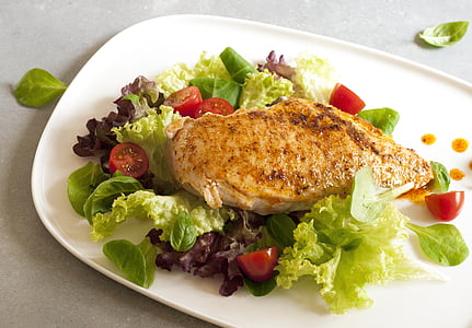 marinated meat with lettuce and tomatoes on plate thumbnail