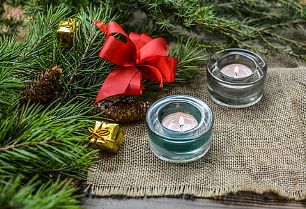 two clear glass votive candles with red ribbon decor thumbnail
