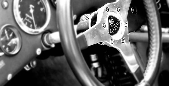 grayscale photo of Lotus vehicle steering wheel thumbnail